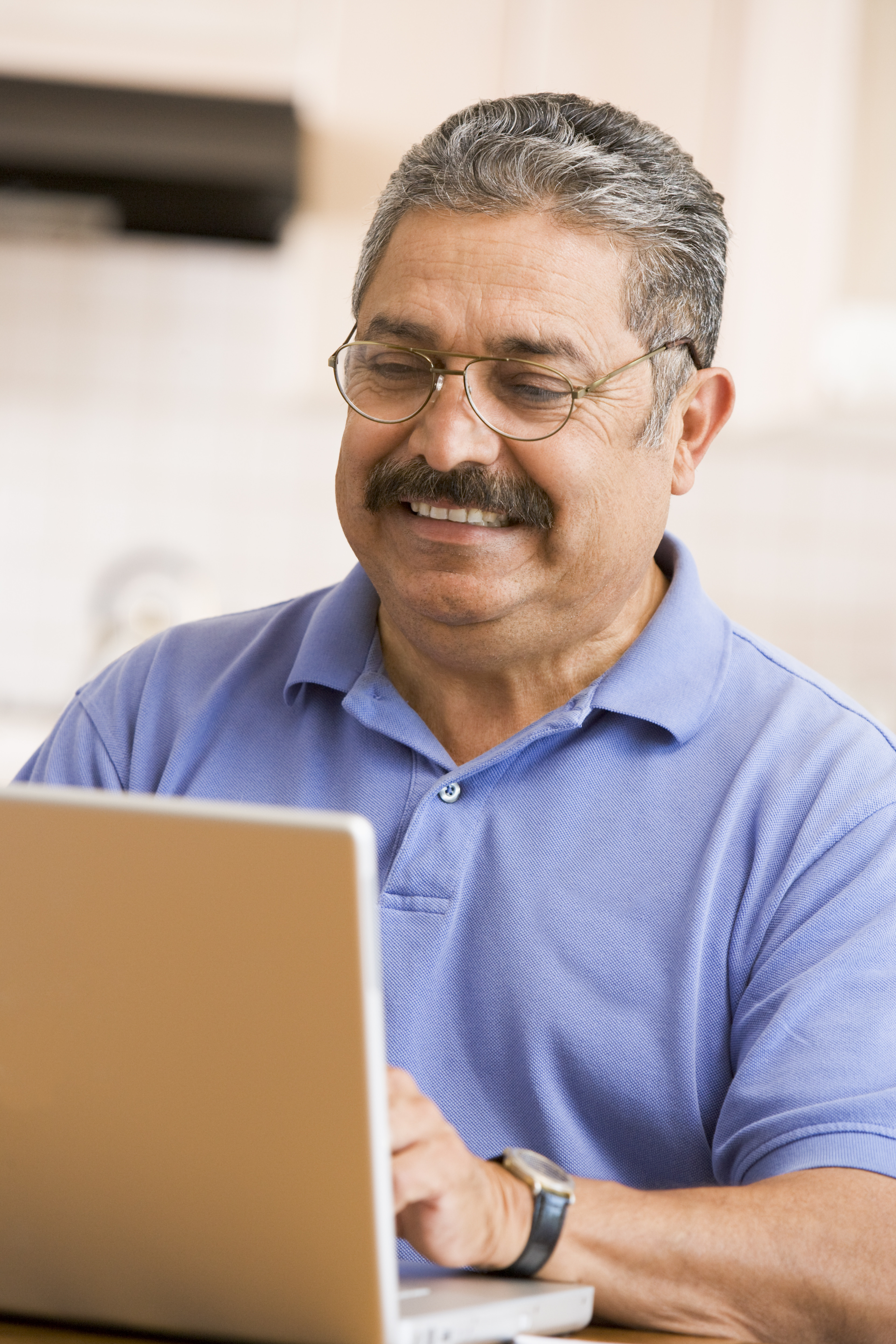 Professional Man sitting and looking at his Laptop